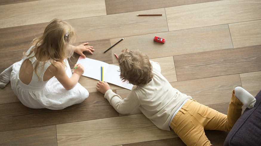 Kids playing on warm hardwood floor